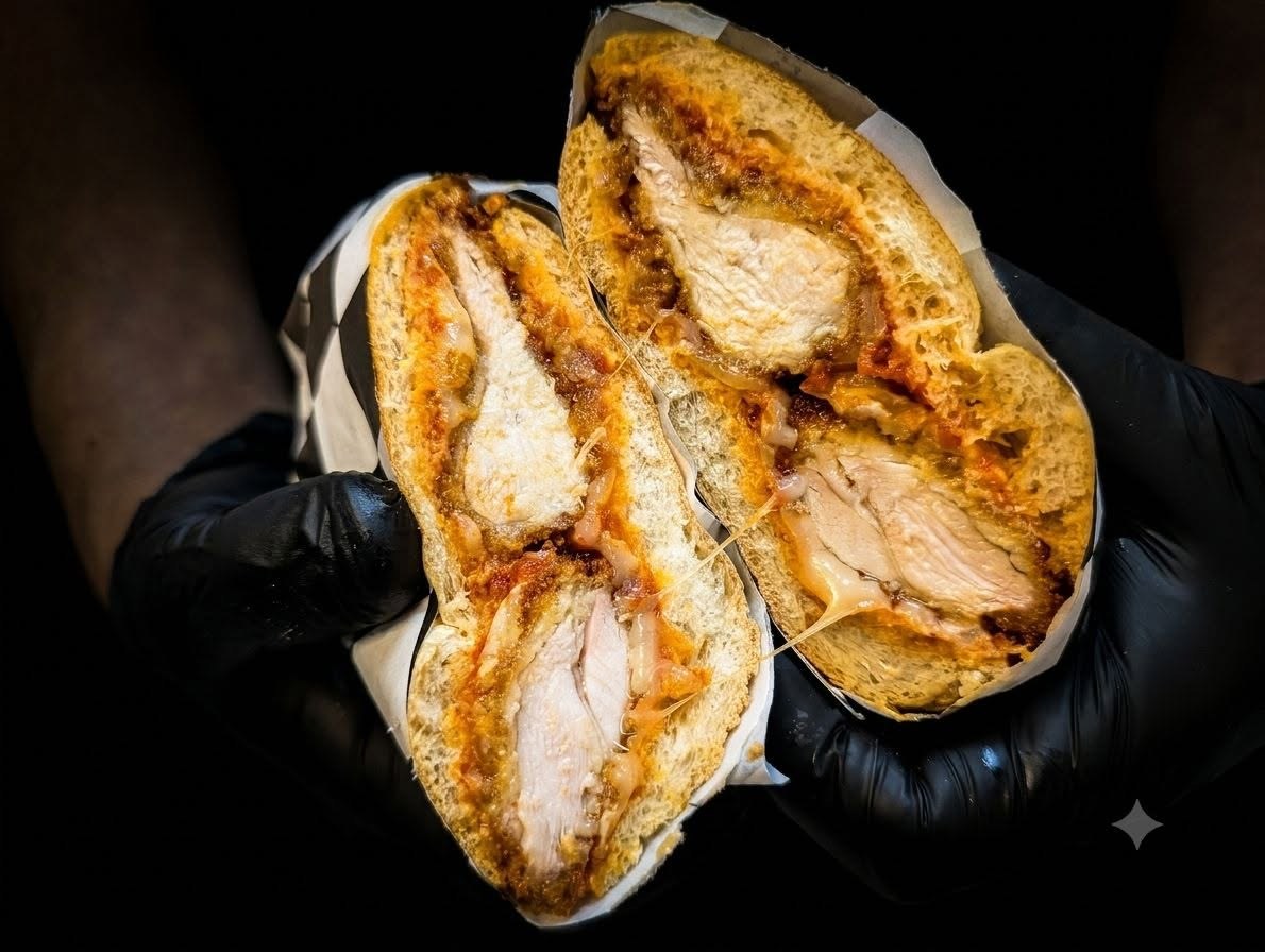Chicken Parmesan fried chicken sandwich cut in half